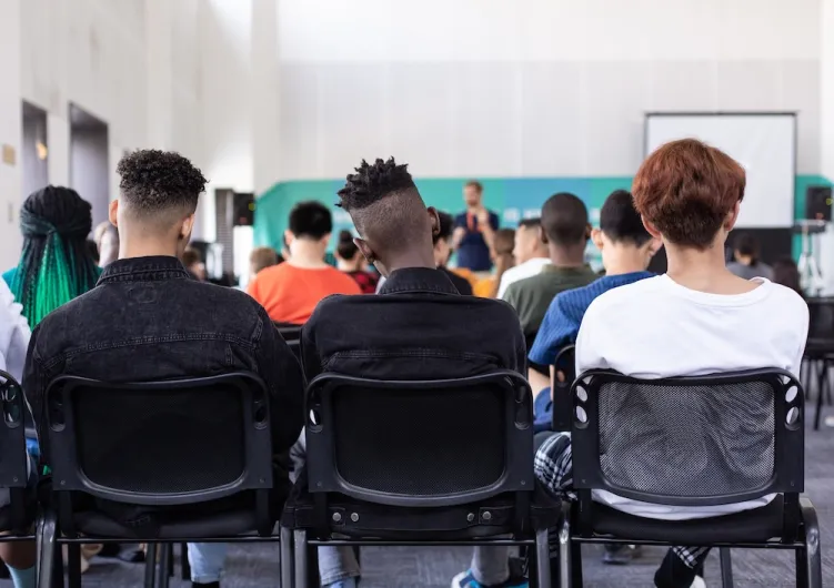 Back of 3 heads in seminar