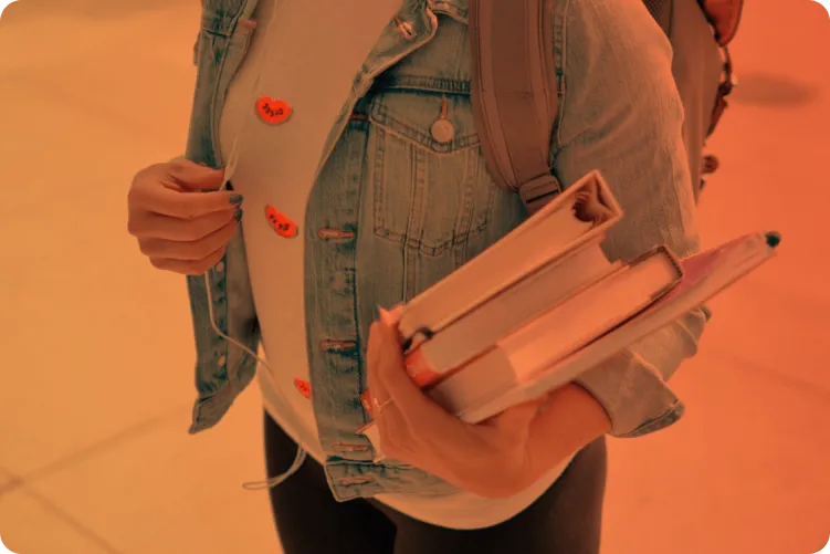 Someone holding books