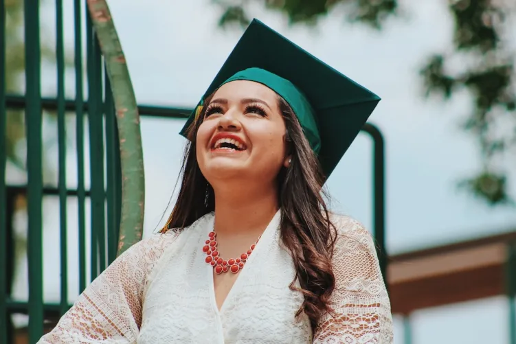 Woman smiling with graduation hat on 