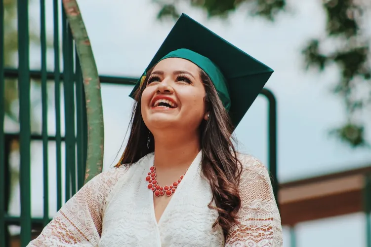 Woman smiling with graduation hat on