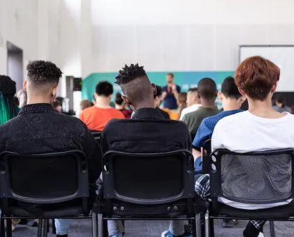 Back of 3 heads in seminar