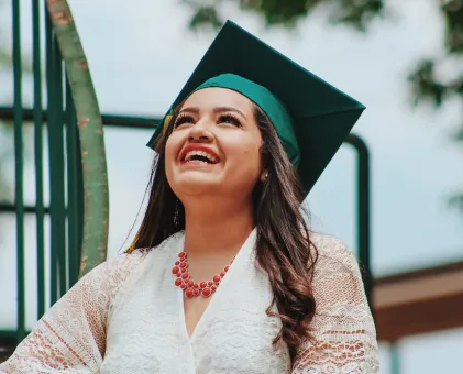 Woman smiling with graduation hat on 