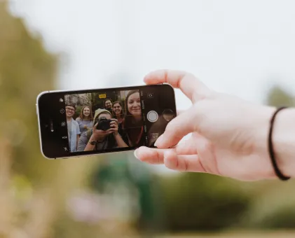 Picture of people taking a selfie on phone